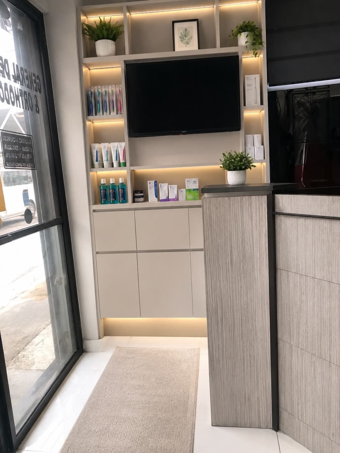 Reception counter and dental product display at Tooth Tales Dental Clinic